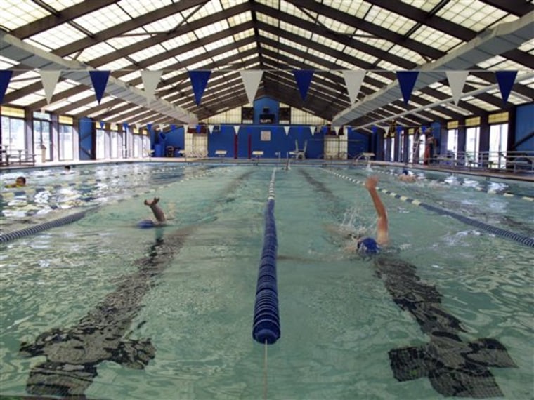 In this May 11, 2011 photo, members of the Anderson Swim Club practice the backstroke at Sheppard Swim Center, in Anderson, S.C. The swim club runs the pool after city officials closed it to the public because they couldn't afford the upkeep. (AP Photo/Jeffrey Collins)